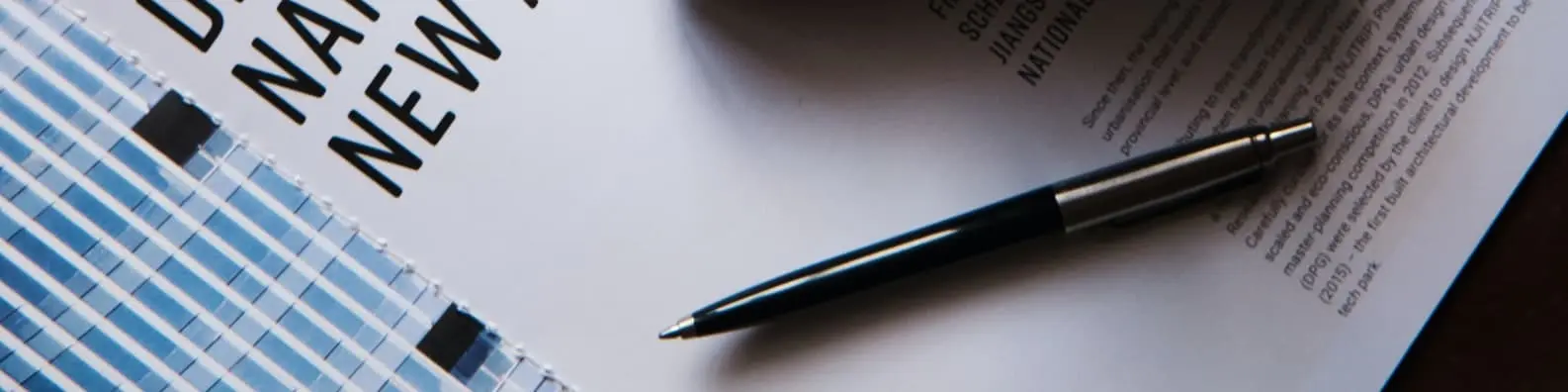 Pen on Book - Mightier Than a Sword Background